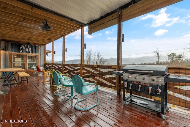 wooden deck featuring area for grilling