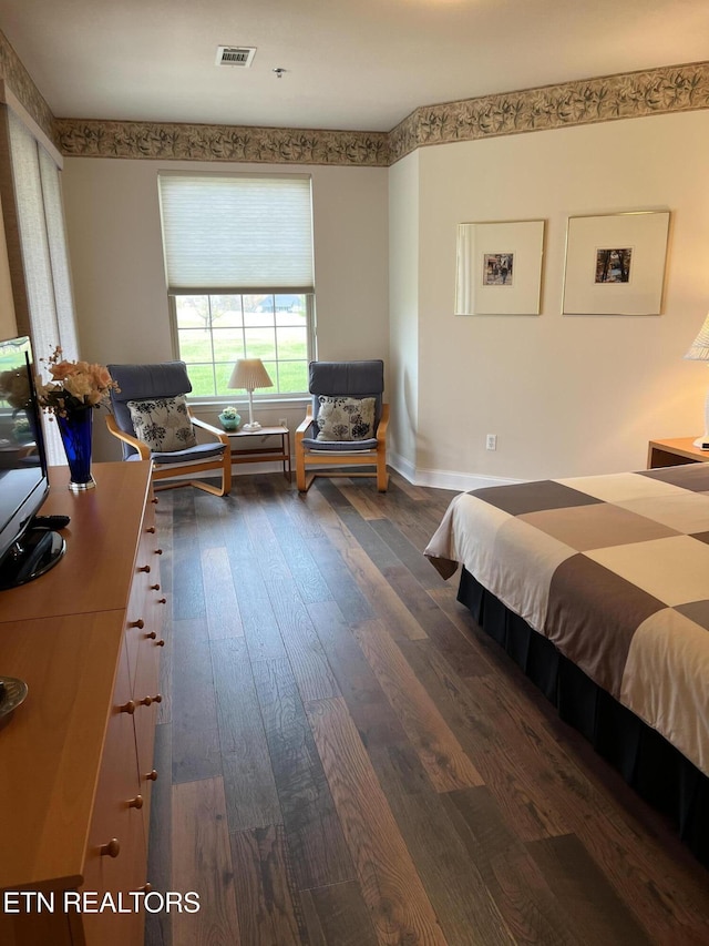 bedroom featuring dark wood-type flooring