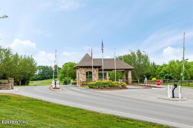 565 Rarity Bay Pkwy Unit 101-A, Vonore, TN 37885 - view of street with a gated entry and traffic signs