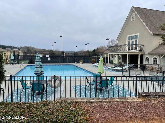 565 Rarity Bay Pkwy Unit 101-A, Vonore, TN 37885 - community pool featuring a patio and fence