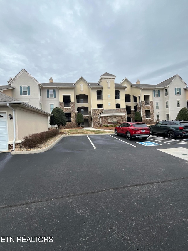 565 Rarity Bay Pkwy Unit 101-A, Vonore, TN 37885 - view of building exterior with uncovered parking