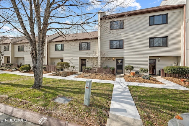 view of property with a front lawn