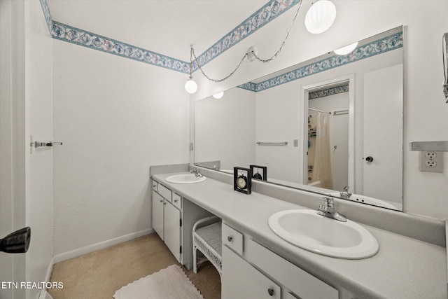 full bath featuring double vanity, shower / tub combo, baseboards, and a sink