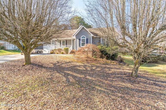 ranch-style house with covered porch