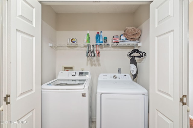 washroom with washing machine and dryer