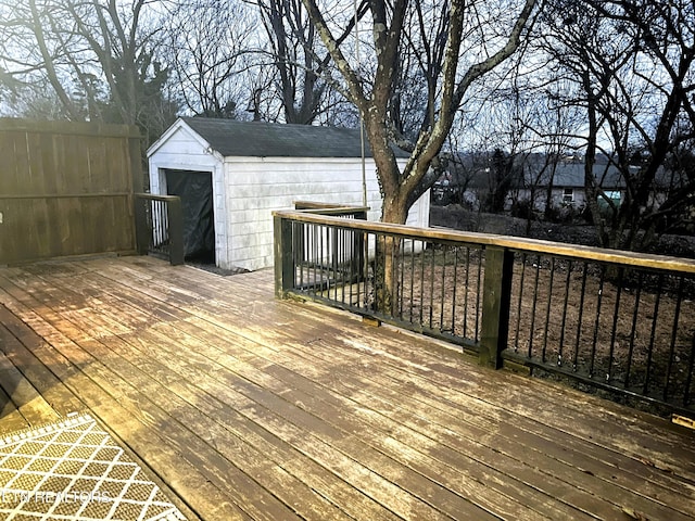 wooden terrace featuring a storage unit