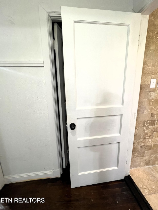 interior details featuring hardwood / wood-style flooring