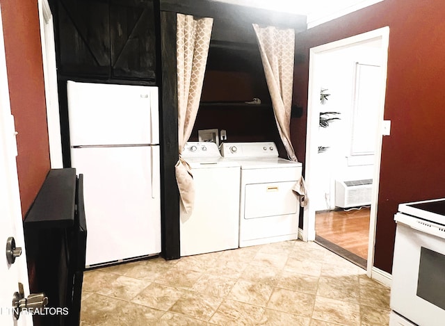 laundry area with an AC wall unit and washer and dryer