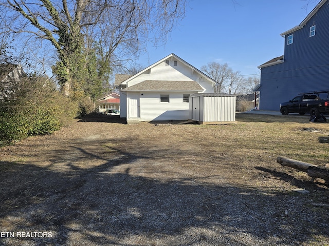 view of side of property with a shed