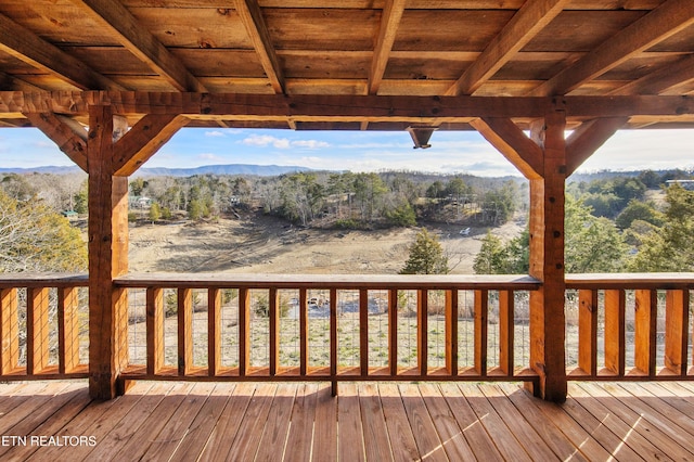 wooden terrace with a mountain view