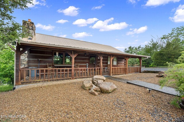 133 Granny Davis Way, Dandridge, TN 37725 - view of front facade featuring metal roof and a chimney