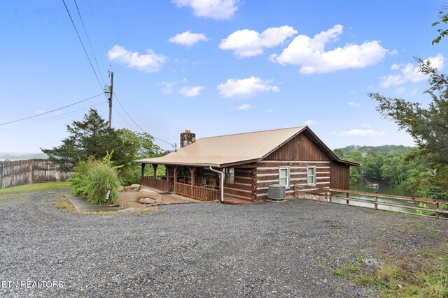 133 Granny Davis Way, Dandridge, TN 37725 - view of front of home featuring central AC unit, a chimney, covered porch, and metal roof
