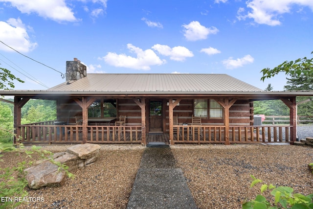 133 Granny Davis Way, Dandridge, TN 37725 - log cabin featuring metal roof and a chimney