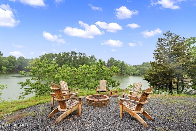 133 Granny Davis Way, Dandridge, TN 37725 - view of patio featuring a fire pit, a water view, and a wooded view