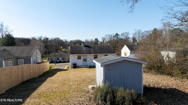 view of yard with a storage unit