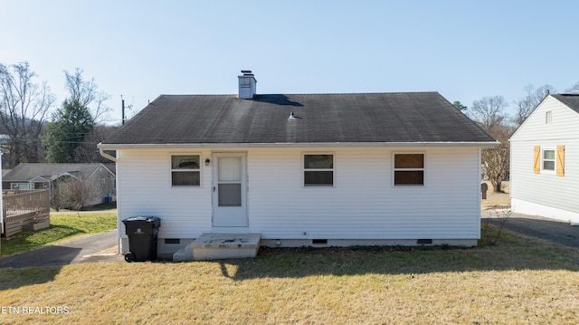 back of house with a yard