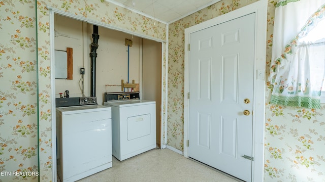 clothes washing area featuring separate washer and dryer