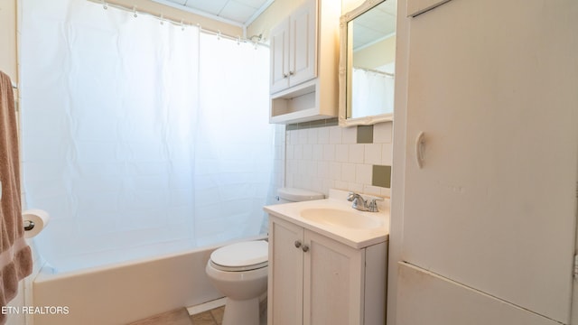 full bathroom featuring shower / tub combo with curtain, tile walls, vanity, decorative backsplash, and toilet