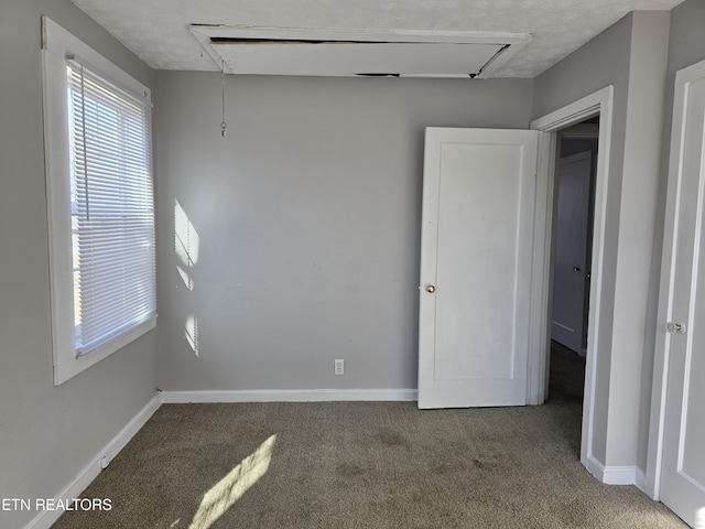 unfurnished bedroom with carpet flooring