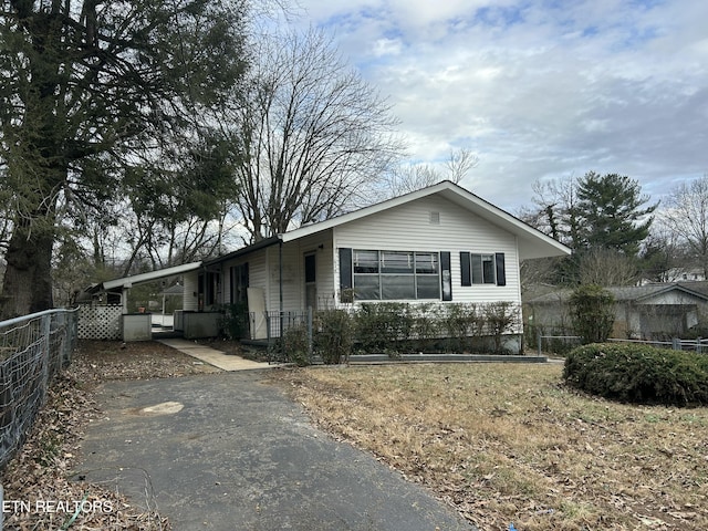 view of front of house featuring a carport