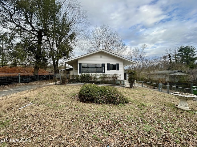 rear view of property with a yard