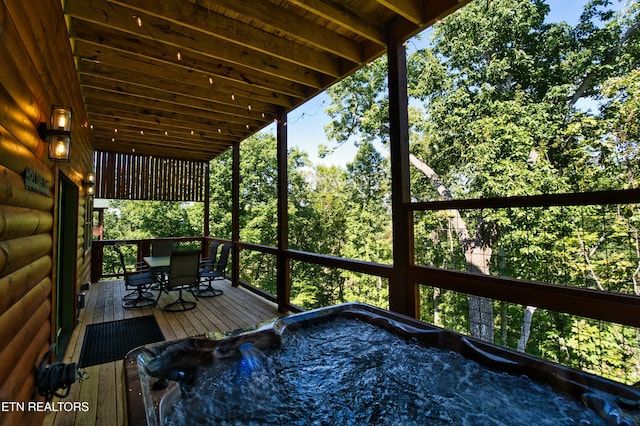 deck featuring a hot tub