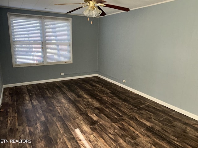 unfurnished room featuring crown molding, dark wood-type flooring, and ceiling fan