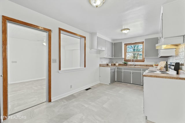 kitchen featuring sink and range