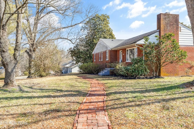 view of side of home featuring a lawn