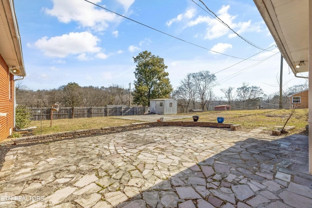 view of patio / terrace featuring a shed