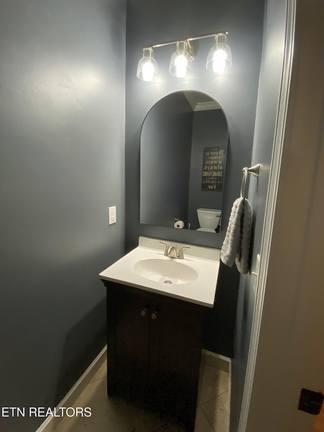 bathroom with vanity and toilet