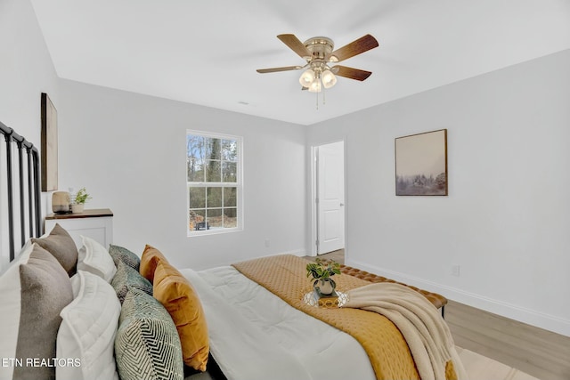 bedroom featuring wood-type flooring and ceiling fan