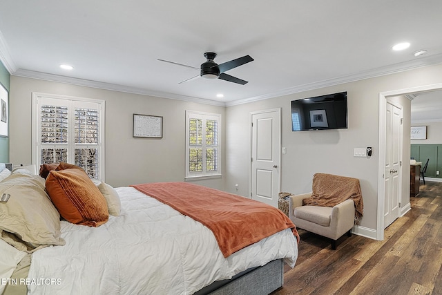 bedroom featuring crown molding, dark wood-type flooring, and ceiling fan