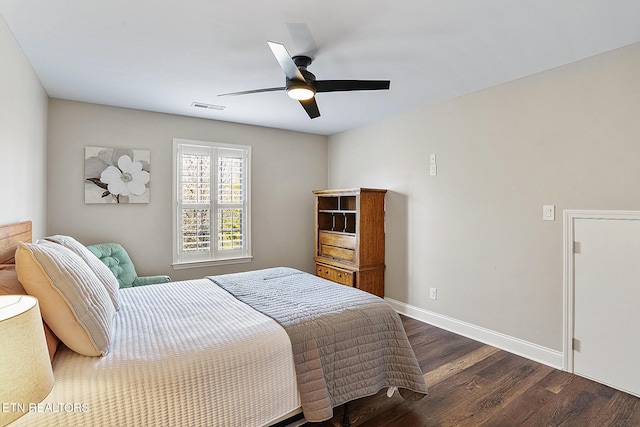 bedroom featuring dark hardwood / wood-style floors and ceiling fan