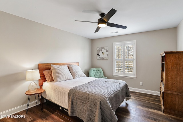 bedroom featuring dark wood-type flooring and ceiling fan