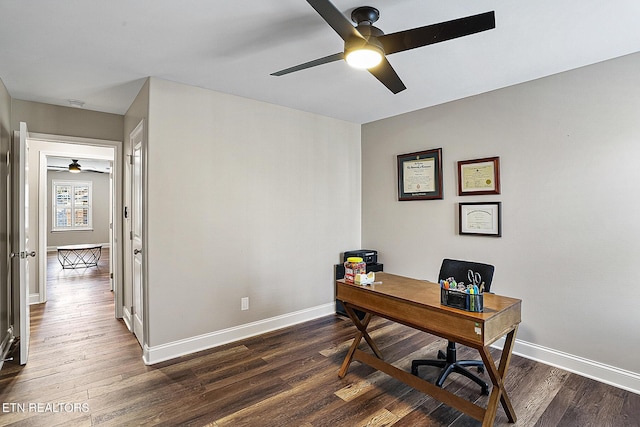 office with dark wood-type flooring and ceiling fan