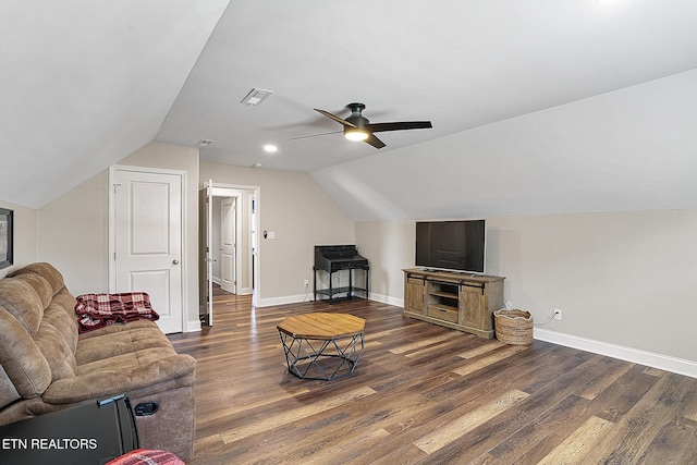 living room featuring ceiling fan, dark hardwood / wood-style flooring, and vaulted ceiling