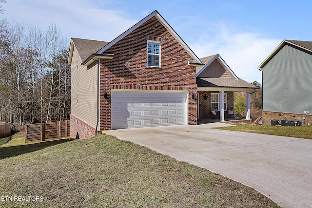 front of property with a garage and a front lawn