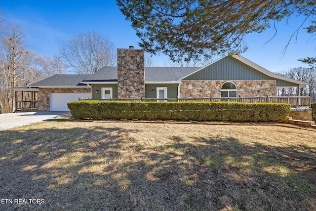 single story home with a garage and a front yard