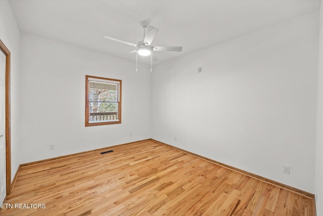 unfurnished room with ceiling fan and light wood-type flooring