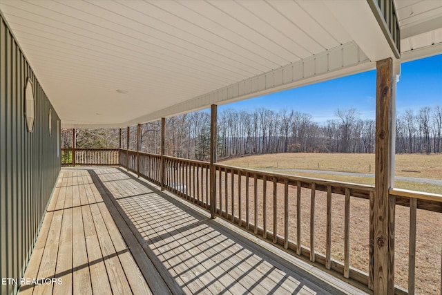 wooden terrace featuring a rural view