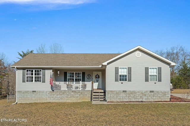 ranch-style home with a front yard and a porch