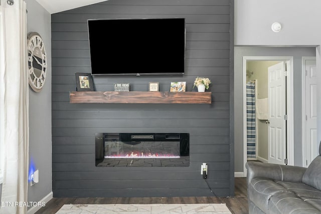 living room featuring a fireplace and dark hardwood / wood-style flooring