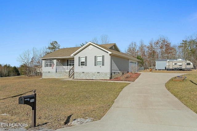 view of front of house with a garage, a front lawn, and a porch