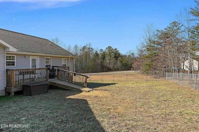 view of yard featuring a wooden deck