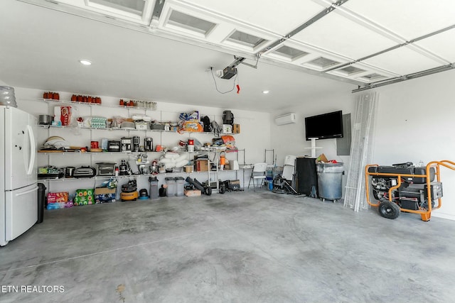 garage with a garage door opener, white fridge, and a wall mounted air conditioner