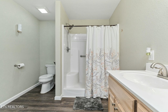 bathroom with vanity, wood-type flooring, toilet, and a shower with shower curtain