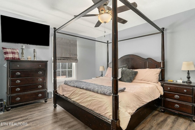 bedroom featuring wood-type flooring and ceiling fan