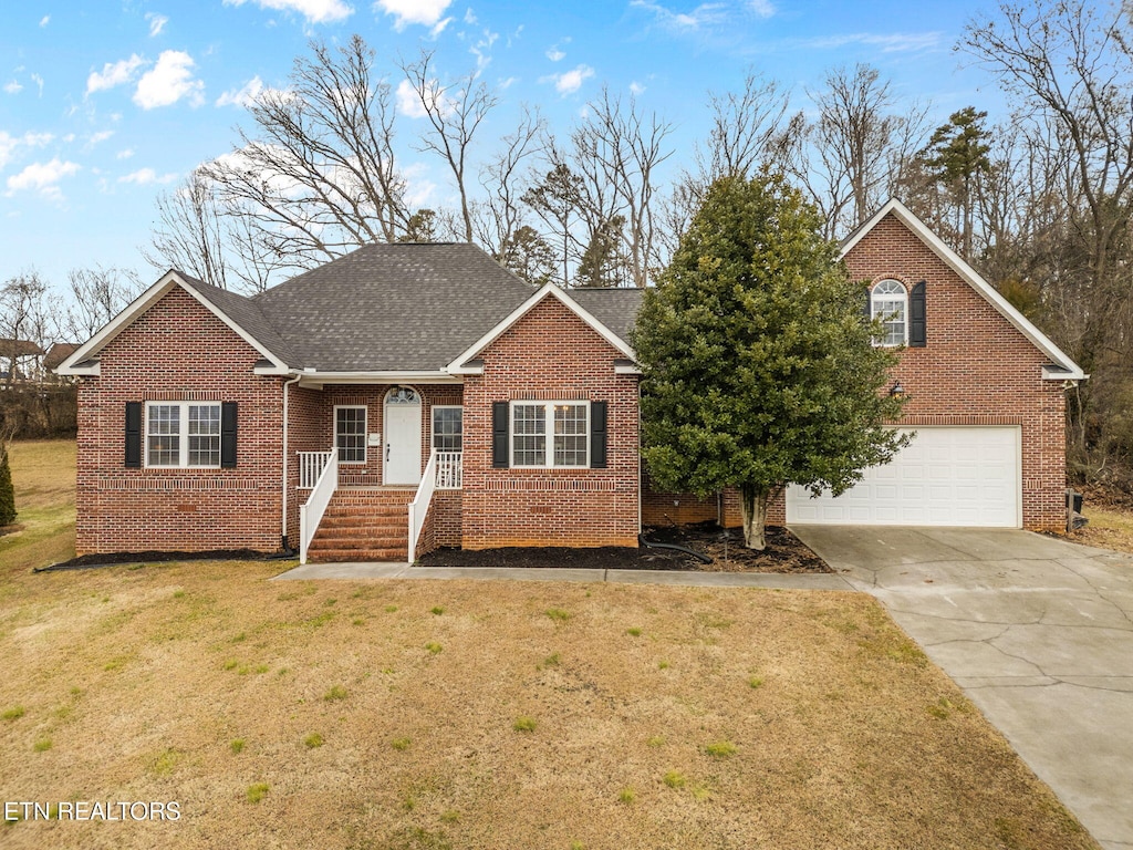 view of front of home with a garage and a front yard