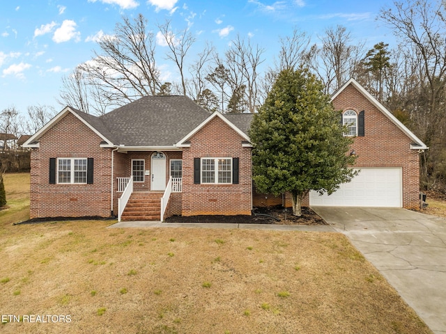 view of front of home with a garage and a front yard